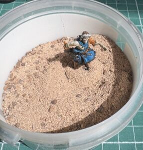 flocage de socle de figurine avec des graviers